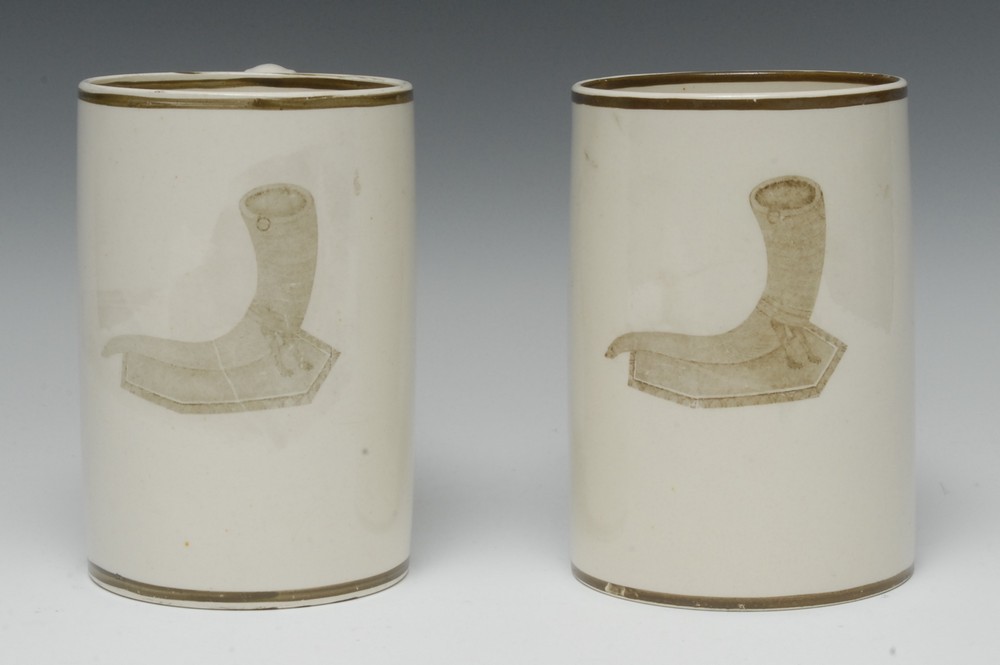 A pair of Wedgwood creamware cylindrical mugs, transfer printed with cornucopia horns, line borders,