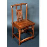 A Chinese hardwood scholar's chair, shaped serpentine cresting rail above a panelled splat and seat,