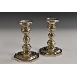 A pair of Portuguese silver candlesticks, waisted campana sconces with detachable nozzles,