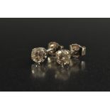 A pair of diamond solitaire stud earrings, each round old brilliant cut diamond approx 0.