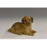 A late Victorian cold-painted bronze, of a recumbent dog, 4cm high, 8cm wide, stamped Déposé,