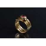 Tiffany - a ruby and diamond coiled snake ring, the snake head inset with a single ruby approx 0.
