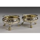 A pair of large George II Rococo silver cauldron salts,