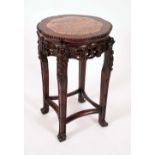 A Chinese padouk wood jardiniere stand, lobed circular top with inset soapstone panel,