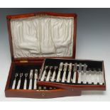 A set of six George VI silver and mother-of-pearl dessert knives and forks, mahogany case,