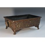 A Japanese brown patinated bronze rectangular bonsai trough, the sides cast in relief with carp,