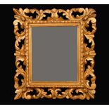 A 19th century gilt gesso and softwood shaped rectangular looking-glass, mirror plate,