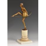 Bruno Zach (1891 - 1945), an Art Deco cold-painted and gilt-patinated bronze, of a hoop dancer,