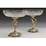 A pair of German silver figural table centre epergnes,