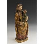 An 18th century South European softwood and polychrome gesso hagiographic carving,