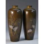 A pair of Japanese dark patinated bronze vases,