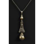 A fine quality natural salt water pearl and diamond pendant necklace, diamond encrusted floral body,