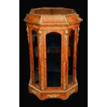 A 19th century French gilt metal mounted kingwood octagonal room centre vitrine,