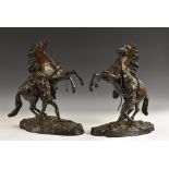After Guillaume Coustou the Elder (1677 - 1746), a pair of brown patinated equestrian bronzes,