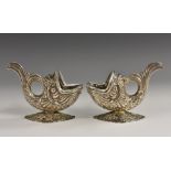 A pair of Continental silver novelty salts, as fish, pierced Rococo bases,