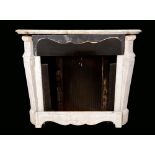 A 19th century marble fire surround, shaped serpentine mantel, canted jambs with scroll pilasters,