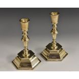 A pair of Edwardian silver candlesticks, of William & Mary design, tapered cylindrical sconces,