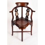 A Chinese hardwood corner chair,