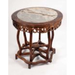A Chinese hardwood circular centre table,