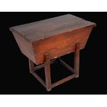 A 19th century elm dough trough, lift-off cover, joined underframe, 65cm high,