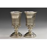 A pair Continental silver goblets, each flared and engine turned above an acanthus socle,