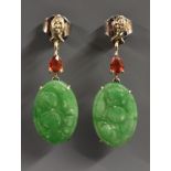 A pair of red stone and carved jade drop earrings, carved oval jade floral panel,