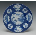 A Bow circular plate, painted with central landscape,