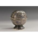 An 18th century style silver plated globular soap box, hinged pierced cover, shaped circular base,