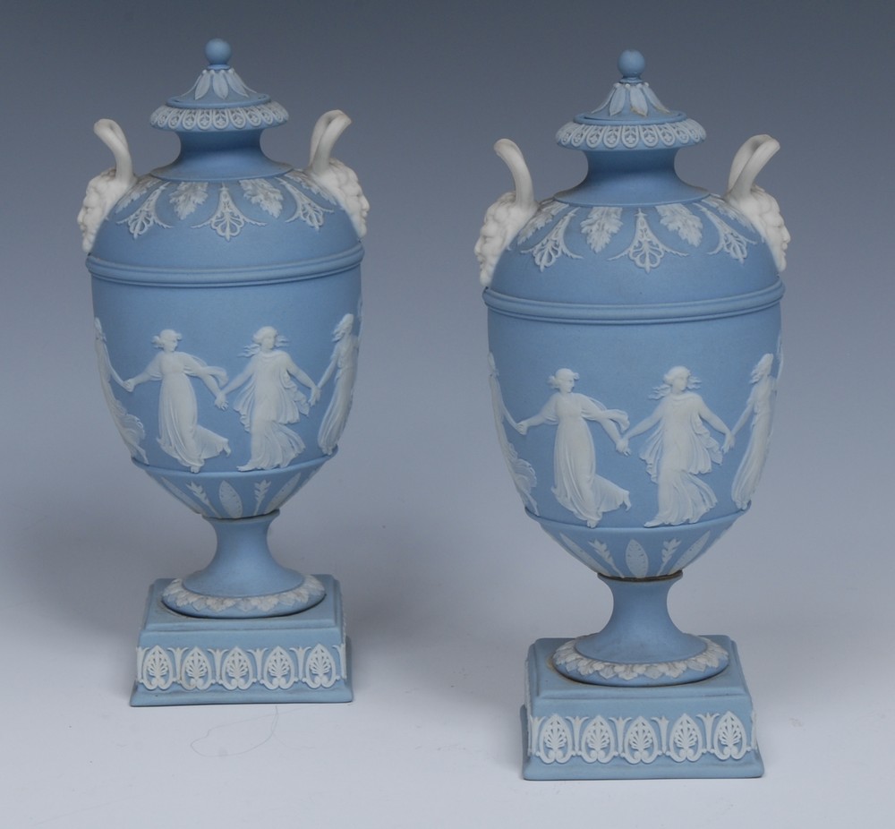 A good pair of Wedgwood Jasperware pedestal ovoid vases and covers,