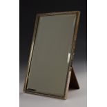 A George V silver rectangular easel table mirror, bevelled plate, bead-and-reel, 32.