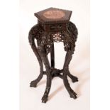 A Chinese padouk wood hexagonal jardiniere stand, beaded top with inset soapstone panel,