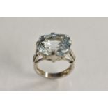 A large aquamarine solitaire ring, single cushion cut aquamarine measuring approx 15mm x 11.2mm x 9.