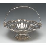 A Victorian Rococo Revival silver shaped circular cake basket, Presented to Saml. M. Moore Esqre.