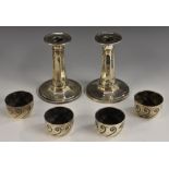 A pair of George V silver candlesticks,