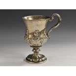 An Anglo-Indian silver pedestal campana mug, chased with a band of acanthus,