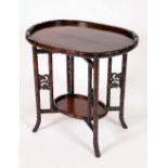 A Chinese padouk wood folding tea table, with two graduated oval trays,