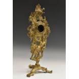 A 19th century gilt metal cartouche shaped pedestal pocket watch stand, cast with Chronos,