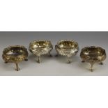 A matched set of four Victorian silver cauldron salts, of George II design,