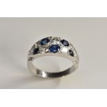 A contemporary sapphire and diamond ring,