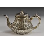 A Victorian Irish silver pear shaped teapot, hinged cover with knop finial,