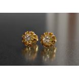 A pair of diamond solitaire stud earrings, each round old brilliant cut diamond approx 0.