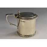 A Victorian silver drum mustard, hinged cover with pierced thumbpiece, flowering foliate borders,