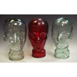 A pair of 20th century moulded pressed clear glass mannequin head,