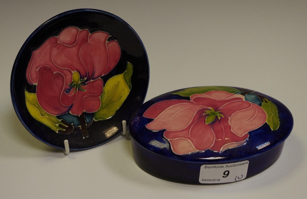 A Moorcroft Magnolia pattern trinket pot and cover;