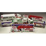 Toys - A Hess toy truck and helicopter, 195; others including two fire trucks,