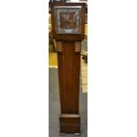 An Art Deco oak miniature longcase, twin winding holes (for restoration) c.