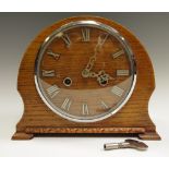An early 20th century oak mantel clock, Smiths movement,