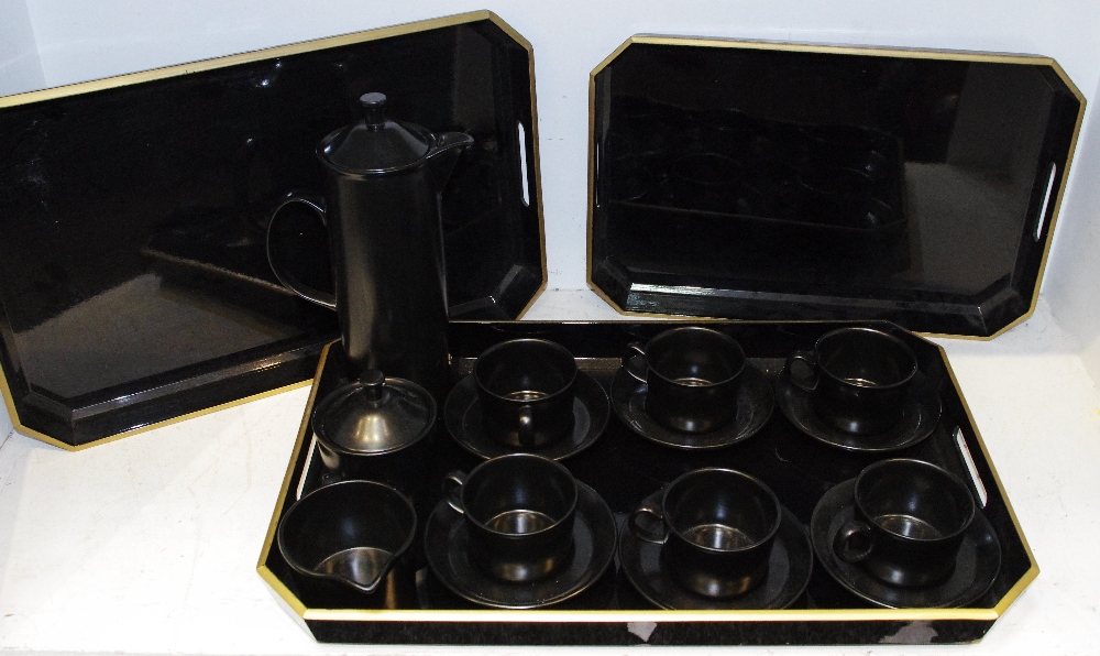 A Wedgwood black basalt coffee set for six comprising coffee cups & saucers, milk jug,