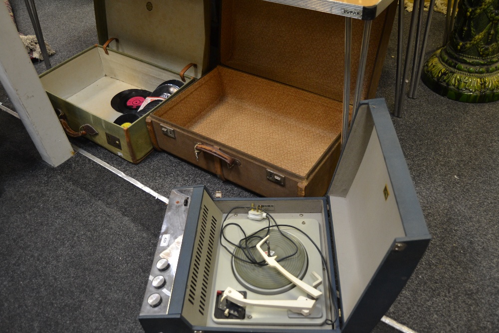 An early 20th century wooden bound steamer trunk; a canvas covered suitcase;