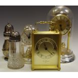 An Anniversary clock; another; a brass carriage clock; a silver plated sugar sifter;